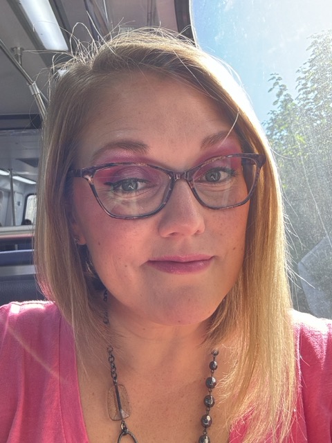 Becky Ferrel, senior brand and digital designer, smiling at the camera